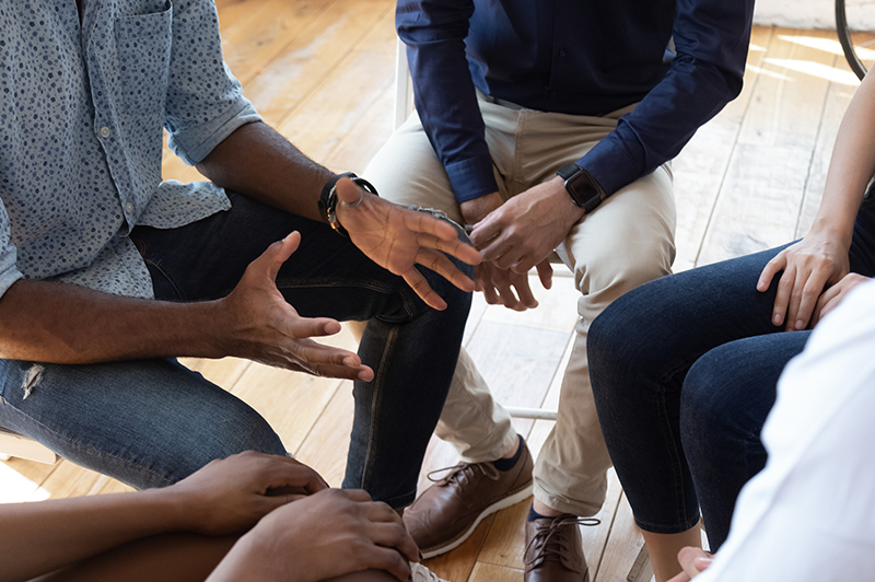 Insight's Benefits - Group of people discussing benefits
