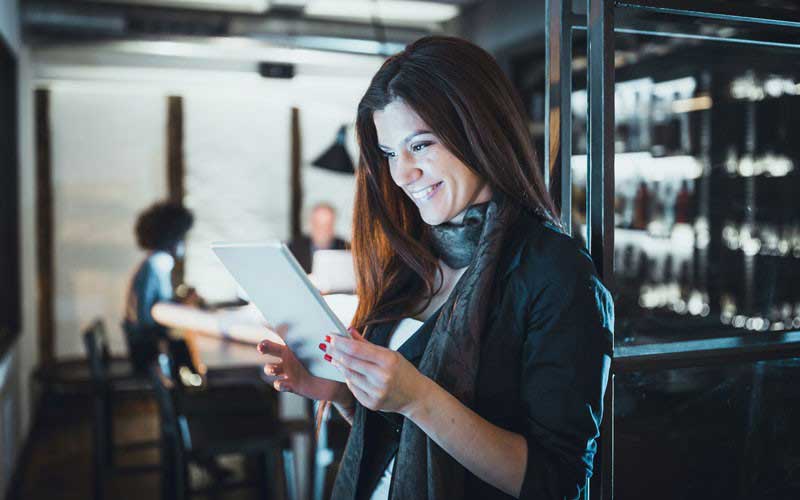 Woman holding tablet device