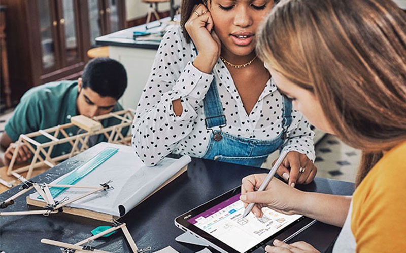 Three students working on project