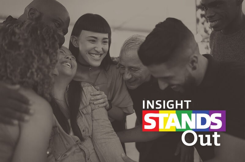 Insight Stands Out Man and woman walking down data center hallway with tablet