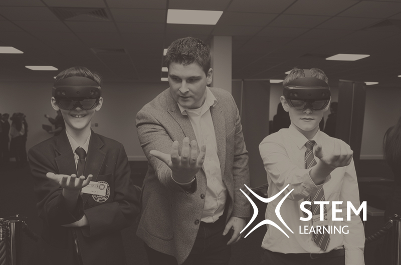 STEM With Insight Smiling students testing holo lens