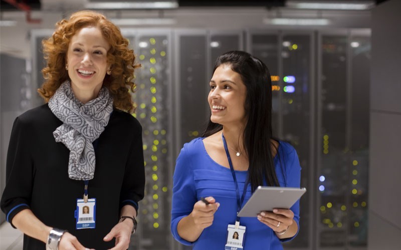 IT team Two women smiling in data centre