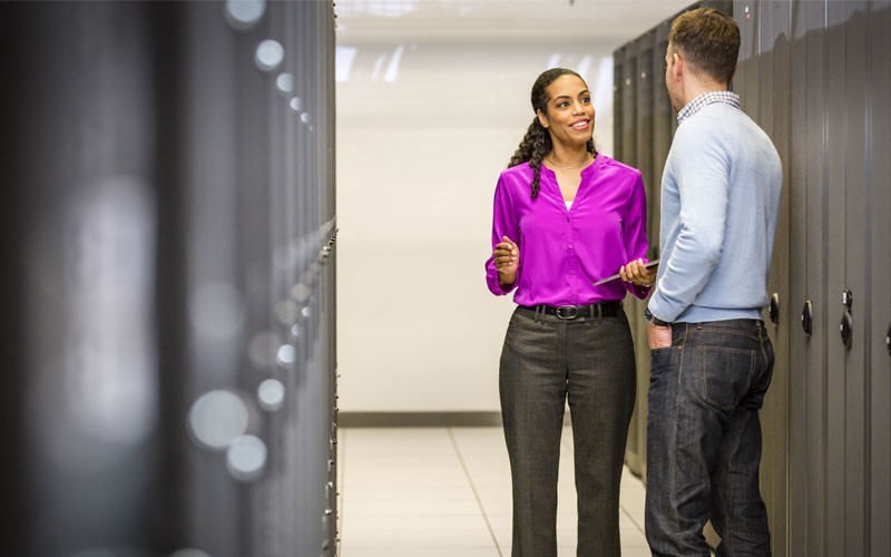 Support digital transformation in government with the infrastructure services, software and systems Man and woman in server room