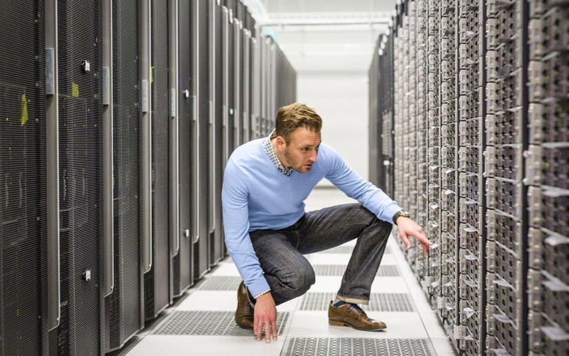 HPE keeps your network safe Man working in server room