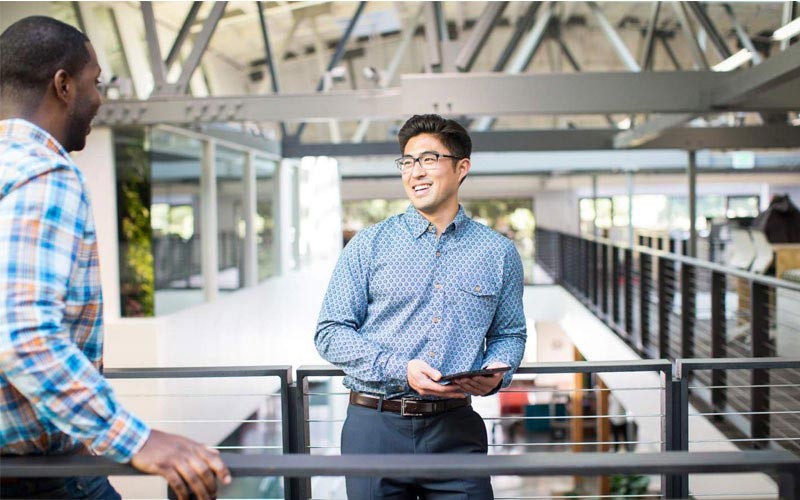 HPE and Insight services for business technology deployment Business man smiling while holding tablet device