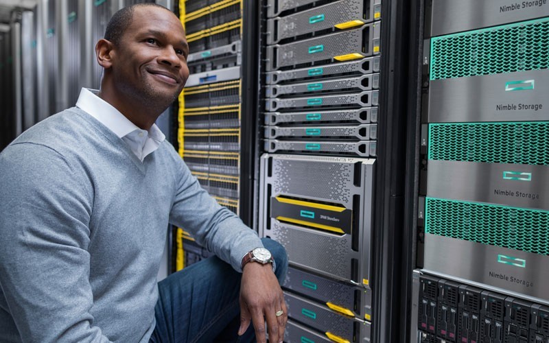 1565229729127 Man smiling in server room