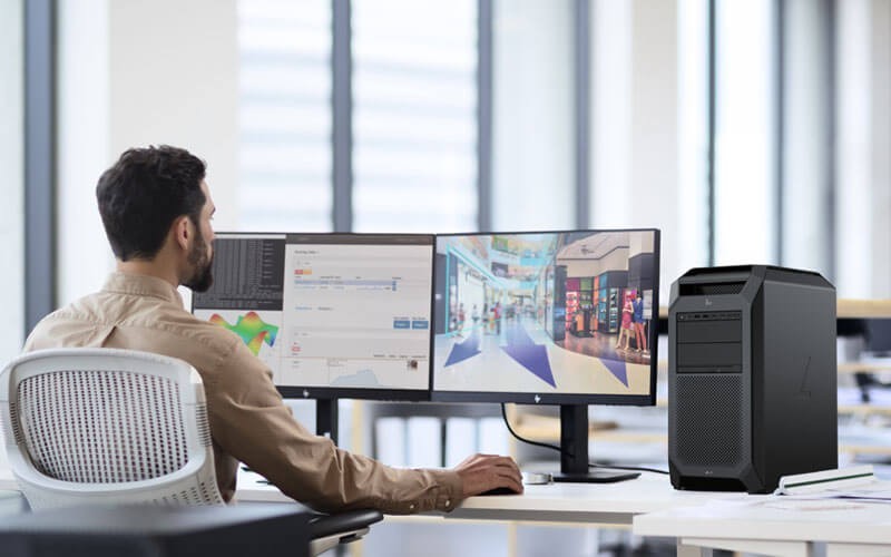 Workstations for your business Business man working on HP monitor and workstation