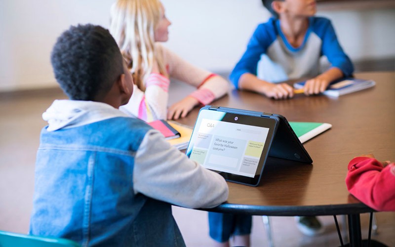 Prepare students for the 21st century Class of students listening to a teacher