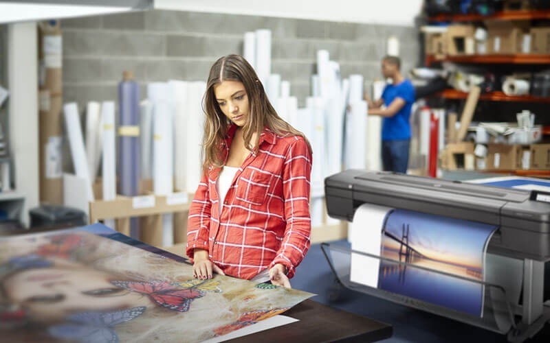 HP DesignJet large-format printer HP woman printing off DesignJet