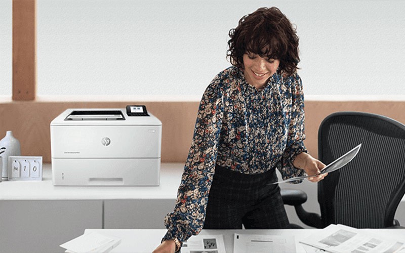Print directly from mobile devices woman picking up printed documents