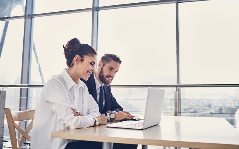 Tame your software Man and woman working together on a project