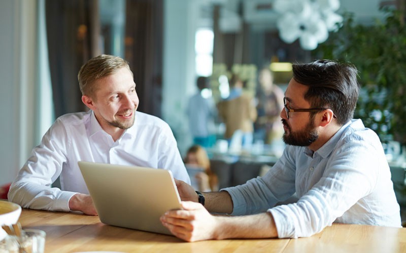 Insight cloud solutions Two male workers having a discussion