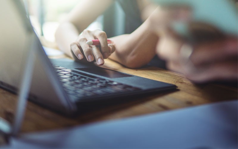 Manage your servers with VSphere from VMware Woman using trackpad on laptop
