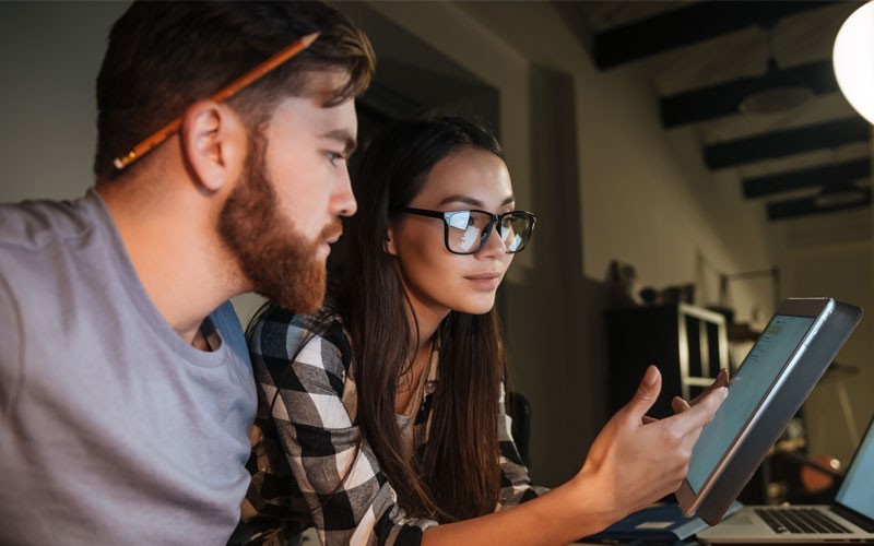 NSX Network Virtualization and Security Platform Two employees looking at tablet